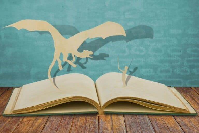 Hero with a sword and a dragon on the pages of a book